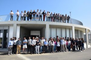 Group picture of all participants and speakers at the SIRTA round observatory. Some people are looking at the picture from the floor, others are on the roof of the observatory.